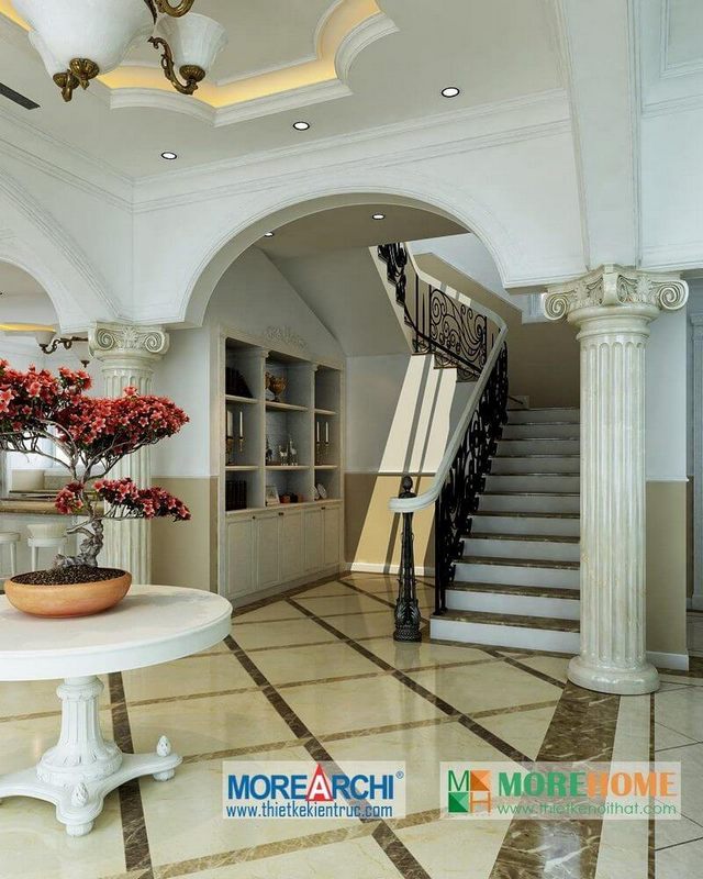 Mẫu cầu thang tân cổ điển được làm từ gỗ tay vịn, khung sắt kết hợp với đá ốp cùng với mặt bậc cao cấp.